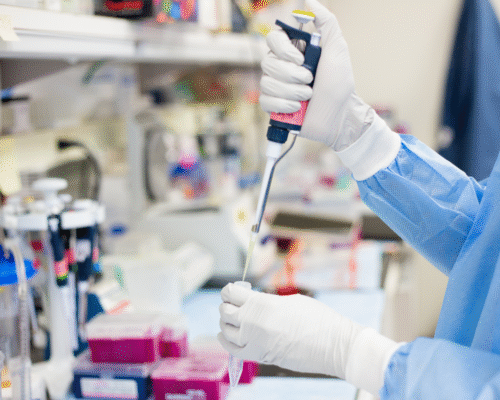 Medical professional using a laboratory pipette to transfer a sample into a test tube, representing diagnostic testing, laboratory analysis, and the importance of timely medical testing to detect conditions such as cancer, stroke, heart attack, and other serious illnesses.
