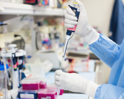 Medical professional using a laboratory pipette to transfer a sample into a test tube, representing diagnostic testing, laboratory analysis, and the importance of timely medical testing to detect conditions such as cancer, stroke, heart attack, and other serious illnesses.